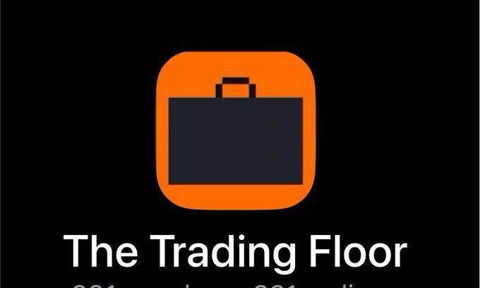 Logo for 'The Trading Floor' featuring an orange square icon with a dark briefcase symbol inside it.