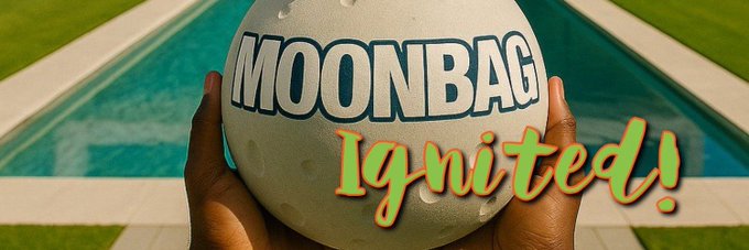 Two hands hold up a white moon-shaped object emblazoned with "MOONBAG" in bold black letters, set against a poolside background, with the word "Ignited!" overlaid in fiery orange and yellow text, reinforcing the post's message of $MBAG's rising momentum on Solana.