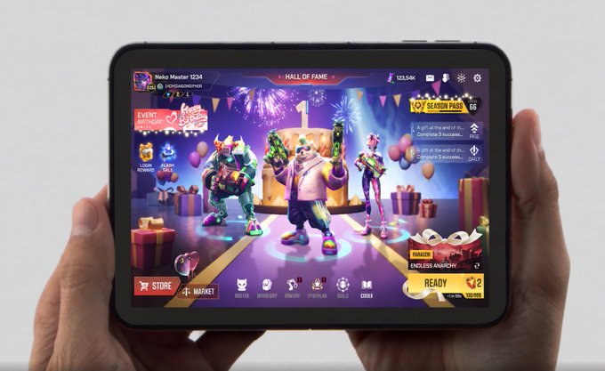 Hands holding a tablet displaying the 'HALL OF FAME' screen of the game 'Free Fire', showing 'Neko Master 1234' at rank #29 and a 'READY' button with 2 tickets.