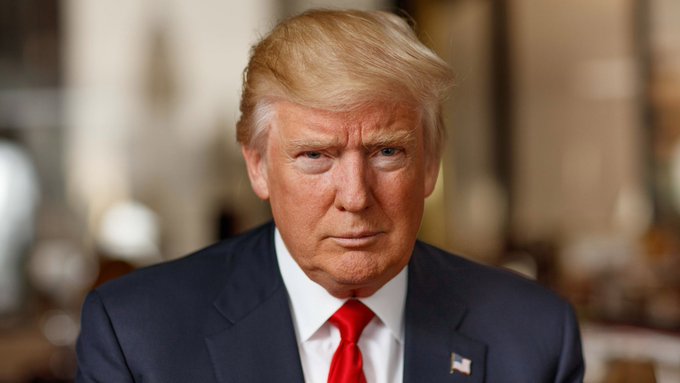 Donald Trump, wearing a navy suit and red tie, is pictured here amidst rising geopolitical tensions. His statement regarding U.S. response to attacks in Jordan is directly linked to the surge in oil prices and $BTC's market reaction.