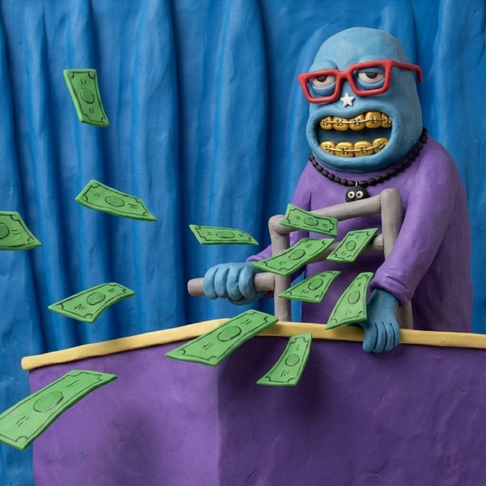 A claymation-style image of a blue character with red glasses, gold grillz, and a beaded necklace behind a purple podium, with green money bills floating around.