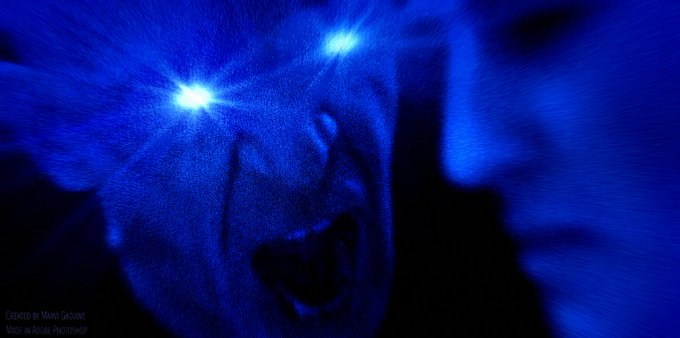 A close-up blue-tinted image of a screaming face with glowing white eyes, credited as 'EXISTED IN MOVIE CASCADES, MADE IN ADOBE PHOTOSHOP'.