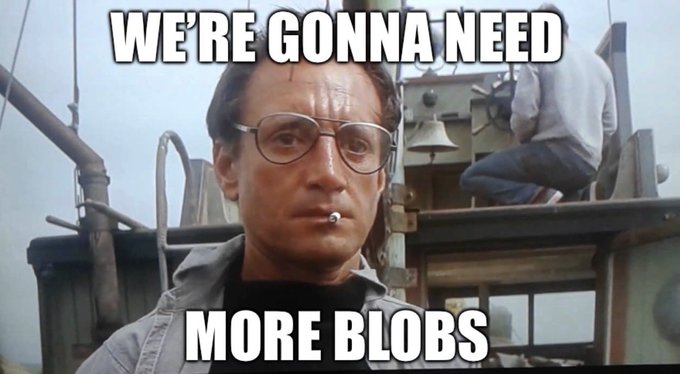 A Jaws movie meme featuring Roy Scheider as Chief Brody with the text "WE'RE GONNA NEED MORE BLOBS" overlaid on the image.