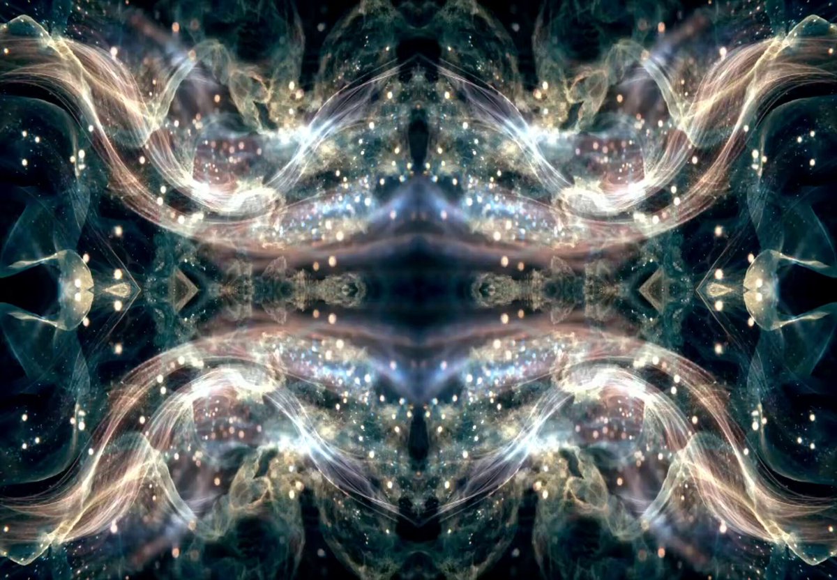 The image features a large, symmetrical design of stars and lines against a dark background. The design appears to be made up of multiple smaller images or patterns that are mirrored across an X shape. This creates a sense of depth and complexity within the composition. The image is accompanied by a caption that reads "Focus on what is in the image and how it relates to the post".