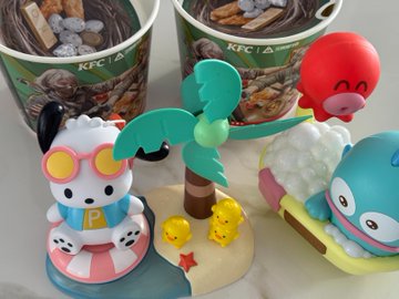 The image features a collection of toy figurines, including a cute little dog wearing sunglasses and other action figures posed as if riding a surfboard or enjoying some fun activities like eating popsicles and drinking out of cups. The toys are placed next to each other on what appears to be a white table against the backdrop of a pink wall with a green tree depicted in the background.
In this particular post, there is a connection between the toy figurines and Bitcoin, as it seems that someone has created a cryptocurrency wallet using these small action figures as currency or tokens. This creative idea adds an interesting twist to the traditional concept of a Bitcoin wallet.