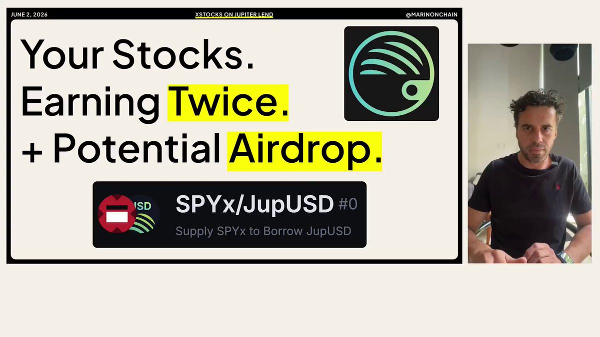 The image features a man sitting at a desk with his hands on his lap, wearing a black shirt. The background of the image shows a poster or banner that says "Your stables are just sitting in your wallet doing nothing One Jupiter Lend @xStocksFi position puts that same cash to work 3 ways → S&P 500 exposure → Borrow stables against it & earn even more → Stack xPoints for potential airdrop Here’s exactly how it works". The poster is related to the post about earning twice and potential airdrop, as they both involve investing in stocks.