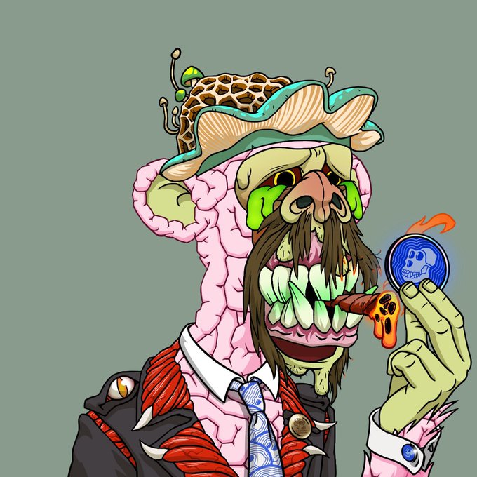 A cartoon illustration shows a green-skinned, ape-like creature with an oversized pink brain exposed on top of its head, wearing a hat adorned with mushrooms and a patterned suit with a tie, while holding up a blue skull-emblem coin next to a cigar. The quirky, artistic style of the image aligns with the post's focus on creative tech (STEM and ART) supplies and the Bored Ape YC Clubhouse's community-driven, playful NFT culture.