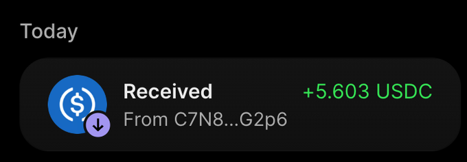 A digital wallet notification showing a 'Received' transaction of +5.603 USDC from an address beginning with C7N8...G2p6.