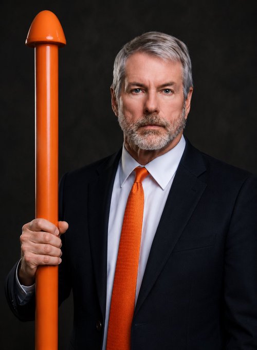A portrait of a serious-looking older man with gray hair wearing a dark suit, light blue shirt, and orange tie, holding a large orange rocket-shaped object against a dark background.