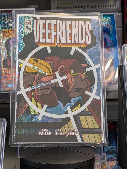 A holographic Veefriends trading card featuring a gorilla character through a sniper scope, credited to Gary Vaynerchuk, with creators including Steve Moskowitz listed.