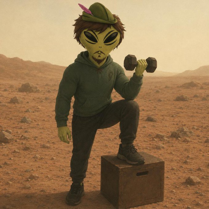 An alien character wearing a green hoodie and a small green hat with a pink feather lifts a dumbbell while standing on a wooden crate in a desert landscape.