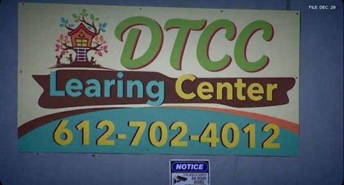 A colorful sign for "DTCC Learning Center" displays a treehouse illustration and the phone number 612-702-4012, with the sarcastic caption "Ya OK buddy" suggesting skepticism or irony toward the advertised business.