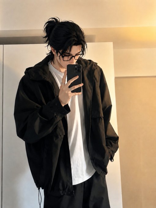 So, let's look at the image. The person is taking a mirror selfie, wearing a black jacket, white shirt, black pants, glasses, and has their hair in a bun. The post says "gm, we'll win this week". We need to connect the image to that. The "gm" is probably "good morning", so the person is greeting, and the confidence in "we'll win" might relate to their outfit or mood. Let's describe the image concisely.

First, identify key elements: person in mirror selfie, black jacket, white tee, glasses, hair in bun. Then relate to the post. The post is a greeting and a confident statement. So the caption should mention the person's appearance and the context.

Wait, the task is to write a concise 1-2 sentence caption describing what's in the image, including key text. The post's text is "gm, we'll win this week". So the image shows a