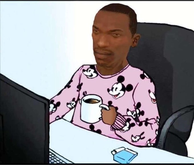 A cartoon image of a man wearing pink Mickey Mouse pajamas sitting at a desk with a laptop, holding a mug, and looking thoughtfully at the screen.