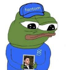 A Pepe the Frog cartoon character wearing a blue "fantom" cap and shirt, holding a photograph of a man.