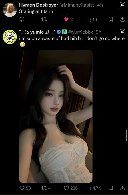 The image shows a tweet from @yumiebbx saying "i'm such a waste of bad bih bc i don't go no where 😭" accompanied by a glamorous selfie of a woman in a white lace corset top with long dark hair. The post, tagged "Algo," appears to be highlighting how the algorithm promotes engagement-bait posts featuring attractive selfies alongside self-deprecating captions.