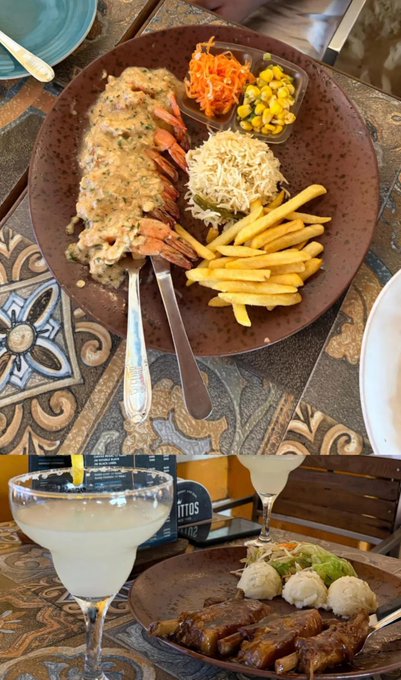 Two photos of a meal: the top shows a brown plate with what appears to be lobster or large prawns in a creamy sauce, served with French fries, shredded cheese, grated carrots, and corn, alongside a fork and knife on a decorative tile table.