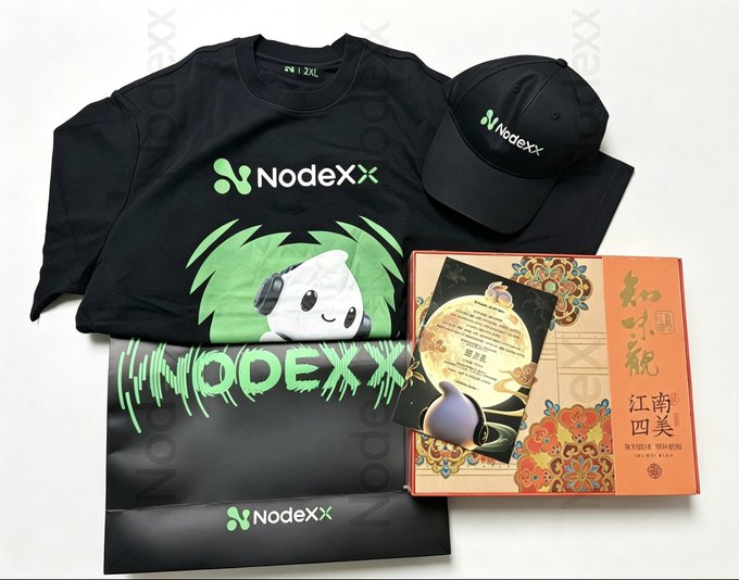 A merchandise bundle from NodeXX including a black t-shirt, cap, and boxed mooncake gift set with the NodeXX mascot design.