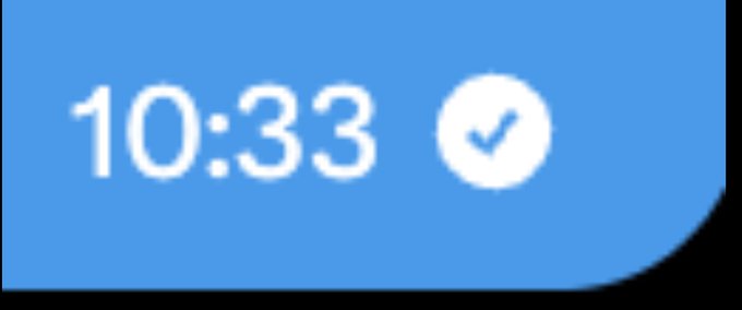 A close-up of a digital screen displaying the time '10:33' in white text alongside a checkmark icon on a blue background.