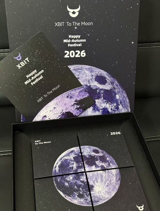 An XBIT 'Happy Mid-Autumn Festival 2026 - XBIT To The Moon' promotional box with cards featuring a moon design displayed inside.