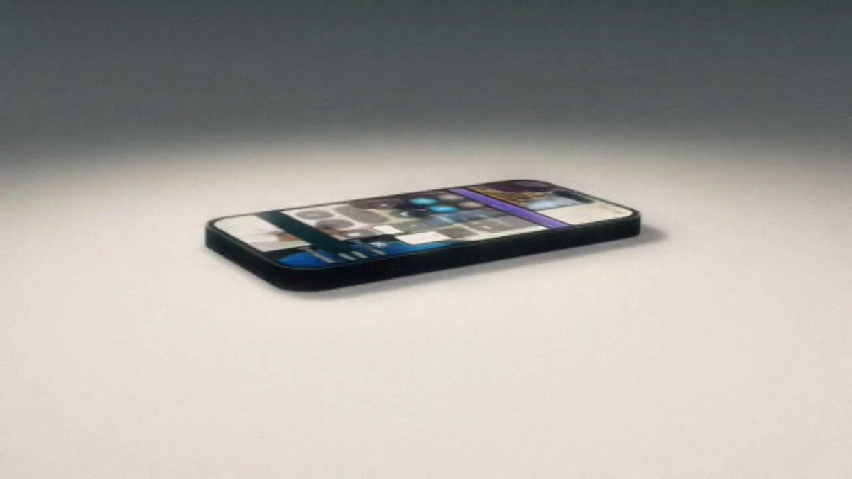 The image features a cell phone placed upside down on its side against a white background. The phone's screen displays an interesting pattern, which appears to be a digital painting or artwork rather than a typical cellphone display. The phone is positioned at the center of the frame and occupies most of the space in the image.