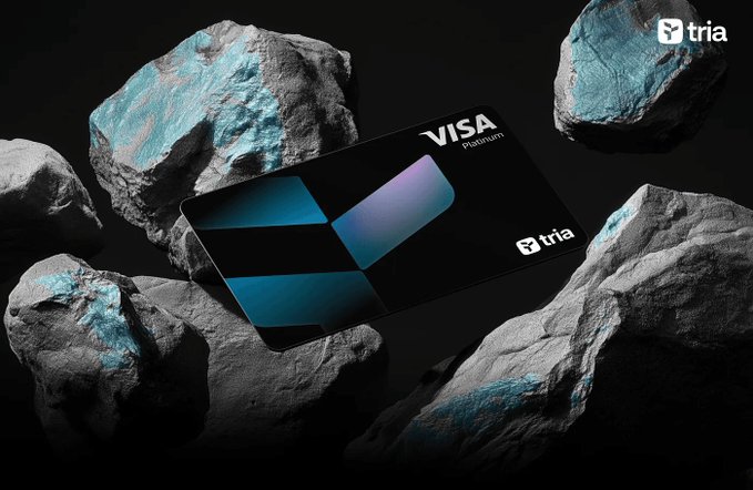 The image features a black Visa card with blue and purple accents, placed among rocks of various sizes. The text "Visa" is visible on the card, indicating its purpose as a payment method. The background of the image is dark gray, providing a stark contrast that makes the card stand out prominently. The phrase "Happy Thursday morning frens Hope you're making onchain and Offchain inside @useTria app and Mindshare leaderboard on @MindoAI" suggests that this post might be related to a discussion about the use of the Visa card for online purchases or sharing experiences with fellow users.