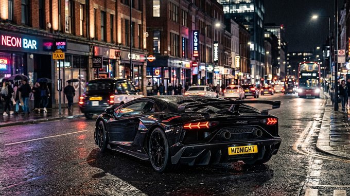A black Lamborghini Aventador with a 'MIDNIGHT' license plate is parked on a wet London street at night, illuminated by city lights and a nearby 'NEON BAR' sign.