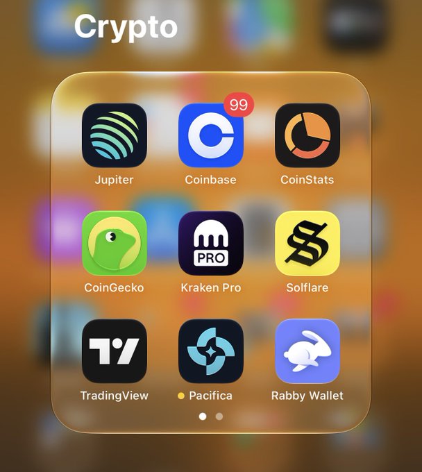 A smartphone home screen displays a "Crypto" folder containing nine app icons: Jupiter, Coinbase (with 99 notifications), CoinStats, CoinGecko, Kraken Pro, Solflare, TradingView, Pacifica, and Rabby Wallet, with Solflare positioned in the right-middle spot that aligns with the user's thumb placement for quick access.