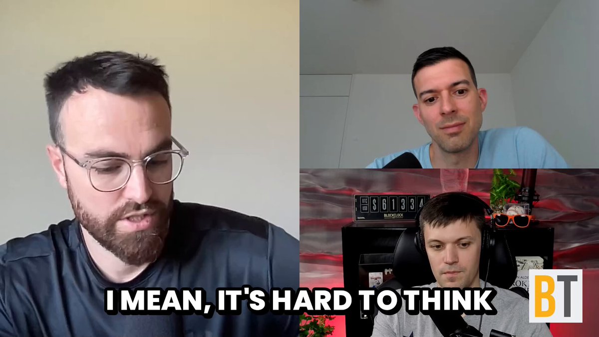 The image shows three men sitting behind a desk, with one man wearing glasses and a beard. The other two men are seated at the desk as well. They appear to be engaged in an interview or discussion about Bitcoin trading strategies. One of the men is reading out loud from a post on the internet that says "I mean, it's hard to think." This quote seems to be related to their conversation about Bitcoin and its value. The image also contains text that reads "Just In: Chase Palmieri just said ...", which could potentially be an article or news piece about Bitcoin trading strategies.