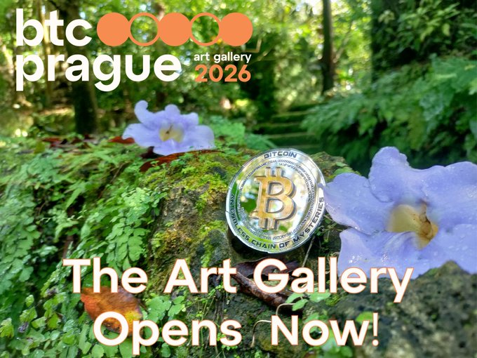 The image features a coin with a Bitcoin symbol on it, surrounded by flowers. The text "It'S 11:11 - The Bitcoin-Only Art Gallery @BTCPrague Opens NOW! Grab a whisky or a pipe, kick your feet up, and tour the gallery using the link in the post below". This suggests that there is an art exhibition at the Bitcoin-only gallery opening, which has opened its doors to the public. Visitors are encouraged to visit the gallery, enjoy some drinks (as indicated by the presence of a whisky glass), and explore the unique artwork on display.