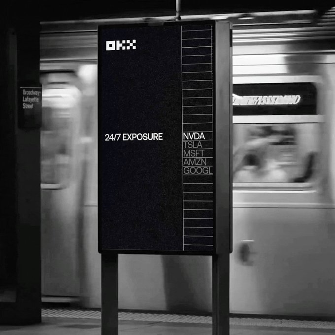In this image, there is a billboard advertisement for a new app called "The World Doesn't Run on Bank Hours anymore" that offers 24 X-Perps and Up to 10X trades every day. The advertisement is displayed next to an escalator at a subway station, capturing the attention of passersby as they walk by or ride the train. It emphasizes the convenience and flexibility offered by this new app in comparison to traditional banking hours.