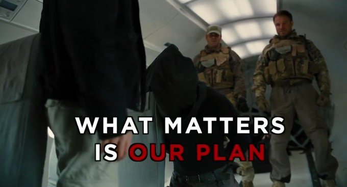 Hooded figures stand inside an aircraft alongside two armed soldiers in tactical gear, overlaid with the text "WHAT MATTERS IS OUR PLAN" in white and red. The image evokes themes of preparation and coordinated action, mirroring the post's message about anticipating market turbulence and emphasizing a unified strategy amid GME volatility.