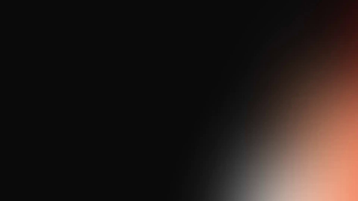 The image features a black background with a gradient effect that transitions from black at the top to white at the bottom. The gradient appears to be a gradient of orange and red colors. There are no texts or other objects present in the image, making it a simple and clean composition focused on the gradient effect.