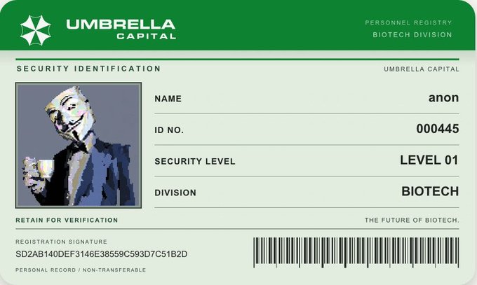A green and white security identification card for 'UMBRELLA CAPITAL' Personnel Registry Biotech Division, showing the name 'anon', ID No. '000445', Security Level 'LEVEL 01', and an image of a person in a suit and mask holding a cup.