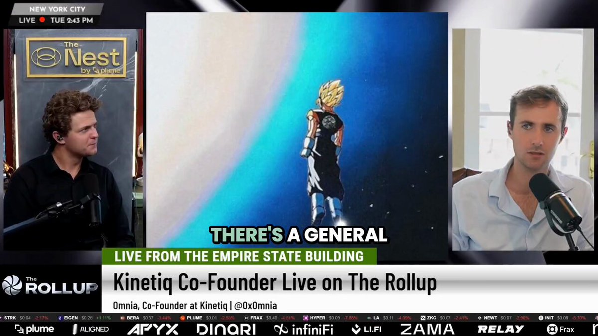 The image shows a television screen with three men sitting behind microphones, appearing to be discussing something related to the content displayed on the screen. The screen features an advertisement for "There's A General" featuring a man standing on top of a building holding a trophy. The text in the image reads "Live from The Empire State Building Kinetig Co-Founder at Kinetig L.L.O.T.M." and "OmniCo founder at Kinetig L.I.O.T.M."
