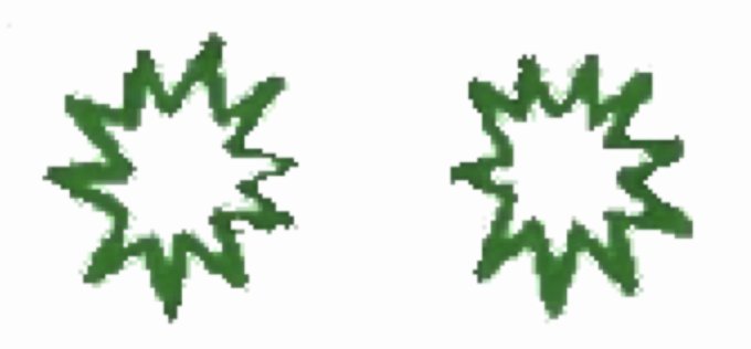 Two pixelated, green starburst or explosion shapes are displayed side-by-side on a white background.