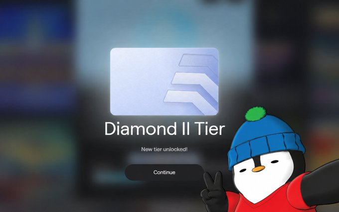 A screen showing a 'Diamond II Tier' unlock notification with a 'Continue' button, overlaid with a cartoon penguin character in a blue beanie and red hoodie making a peace sign.