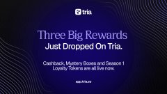 A dark promotional banner for Tria featuring text that reads 'Three Big Rewards Just Dropped On Tria' listing Cashback, Mystery Boxes, and Season 1 Loyalty Tokens.