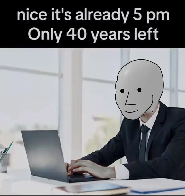 The image shows a person in a business suit with a white featureless "NPC" mask typing on a laptop in an office, with the caption "nice it's already 5 pm, Only 40 years left" — humorously depicting the monotony of 9-to-5 office life as robotic, repetitive work where days blend together until retirement.
