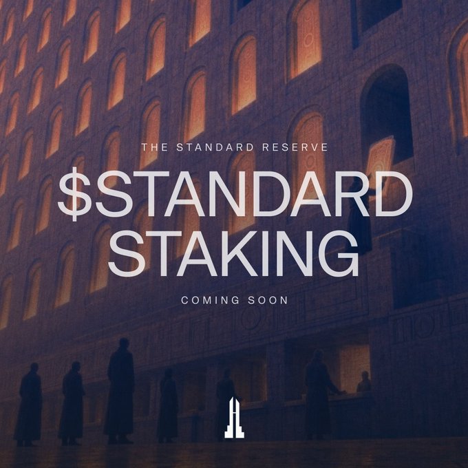 A dimly lit architectural backdrop featuring silhouettes of robed figures and warmly illuminated arched windows serves as the setting for a promotional teaser announcing "THE STANDARD RESERVE - $STANDARD STAKING COMING SOON," visually reinforcing the upcoming S-Bills staking feature where holders can earn variable, non-dilutive APR.