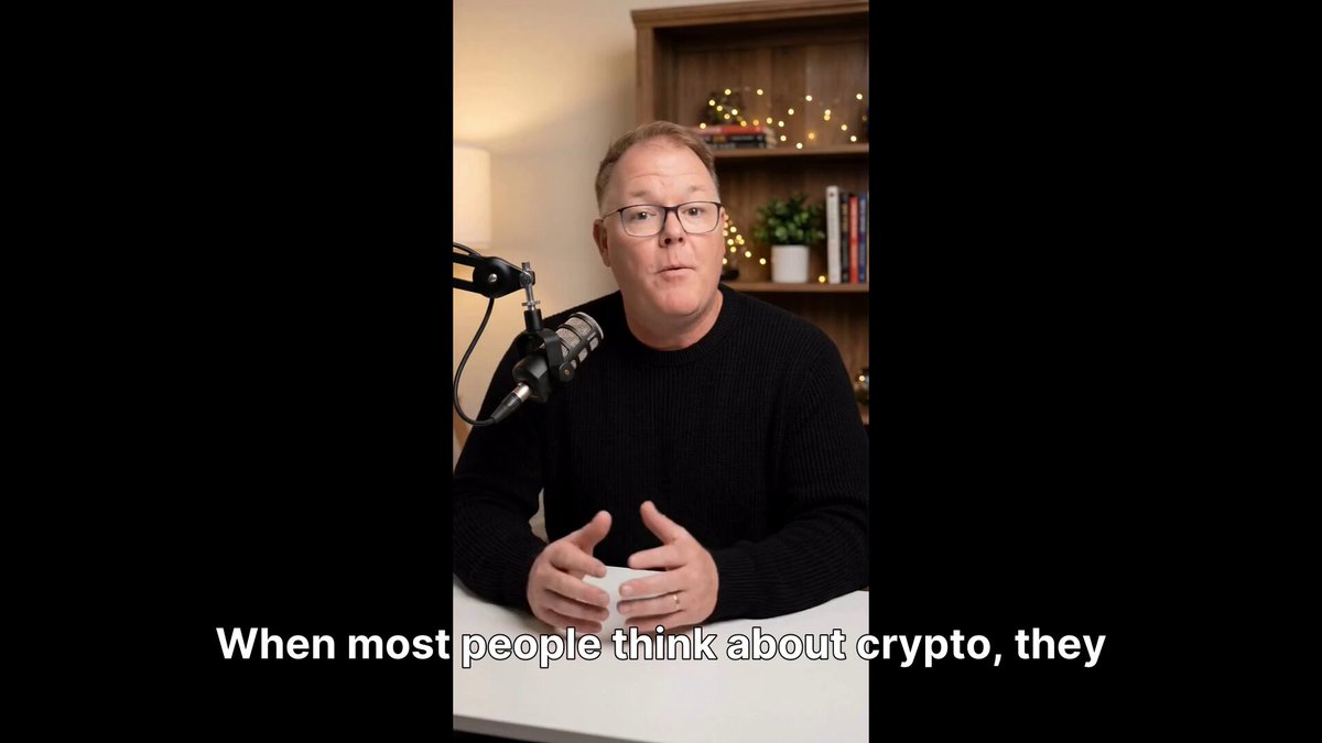 The image shows a man sitting at a table with a microphone, wearing glasses and holding a cup of coffee. He appears to be talking about Bitcoin or cryptocurrency, as indicated by the text in the image that reads "When most people think about crypto, they think about Bitcoin." This quote is from a post on social media, which suggests that the man might be discussing the topic with others who have seen his video. The focus of the image is on the man and his conversation about cryptocurrency or Bitcoin, rather than any other subject matter.