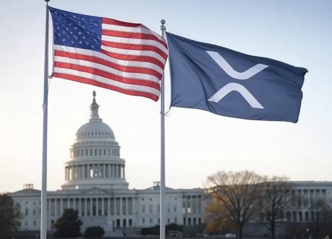 An American flag and a blue flag with a stylized X (XRP/crypto logo) flying together in front of the U.S. Capitol building.