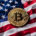 A gold Bitcoin coin rests on an American flag, symbolizing cryptocurrency's place in the U.S. financial landscape. The image visually ties to the post's discussion of JPMorgan's support for the CLARITY Act and its potential implications for XRP and broader crypto regulation.