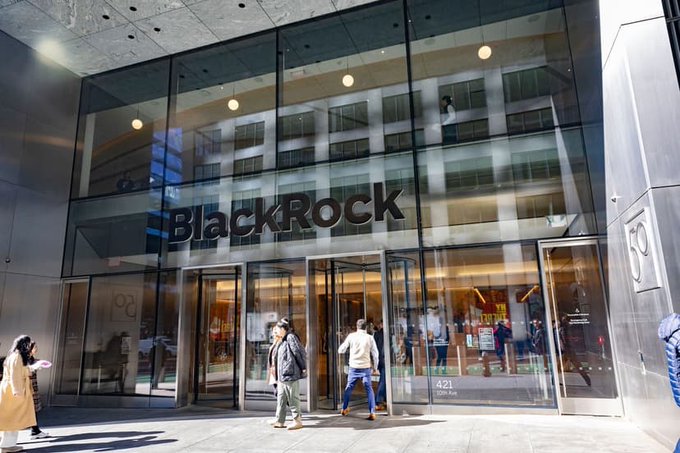 Street-level view of the BlackRock office entrance at 50 Hudson Yards, 421 50th Avenue, New York City, with pedestrians walking by.
