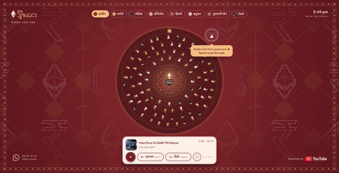 A dark red interface for 'VESAK 2021' displays a circular wheel design with small lit candles or lamps, including a YouTube player for a song 'Niso Poru To Gnath Th Dheyne' from Bhutan.