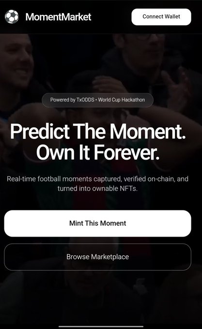 The image shows a landing page for "MomentMarket" featuring the headline "Predict The Moment. Own It Forever." with a subheading noting it's "Powered by TxODDS · World Cup Hackathon," alongside call-to-action buttons for "Mint This Moment" and "Browse Marketplace." The page promotes a platform for turning real-time football predictions into verifiable, tradable NFTs, visually introducing the concept described in the accompanying post about sports predictions becoming on-chain assets.
