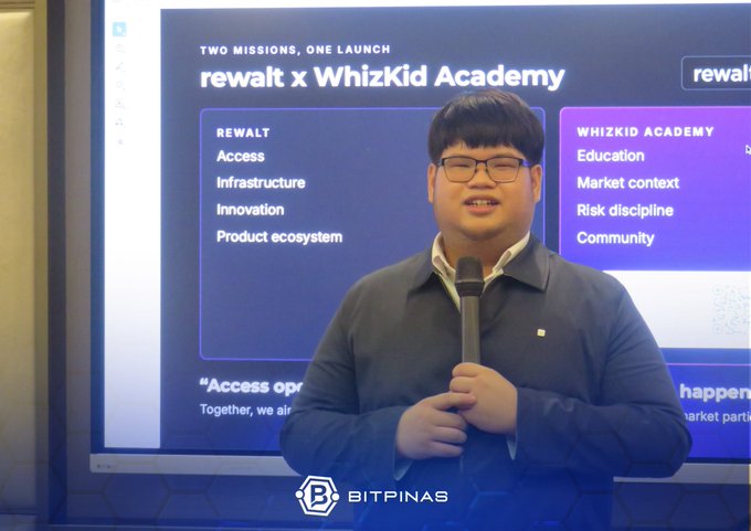 A man in a dark jacket speaks into a microphone in front of a presentation screen titled 'rewalt x WhizKid Academy,' with the 'BITPINAS' logo at the bottom.
