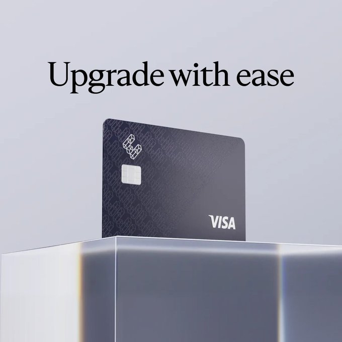 A sleek dark Visa credit card rests atop a silver pedestal beneath the headline "Upgrade with ease," visually reinforcing the message of effortless membership upgrade through options like staking ETHFI, depositing into Liquid, or buying outright for the year.