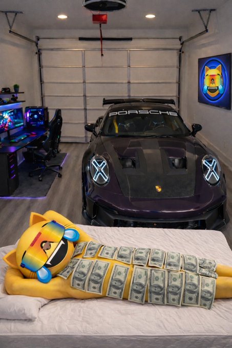A garage features a black Porsche and a gaming setup, with a yellow crying-crying emoji figure covered in dollar bills lying on a bed in the foreground.