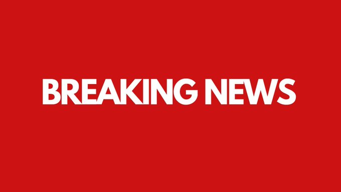 A red screen with bold white text reading 'BREAKING NEWS'.